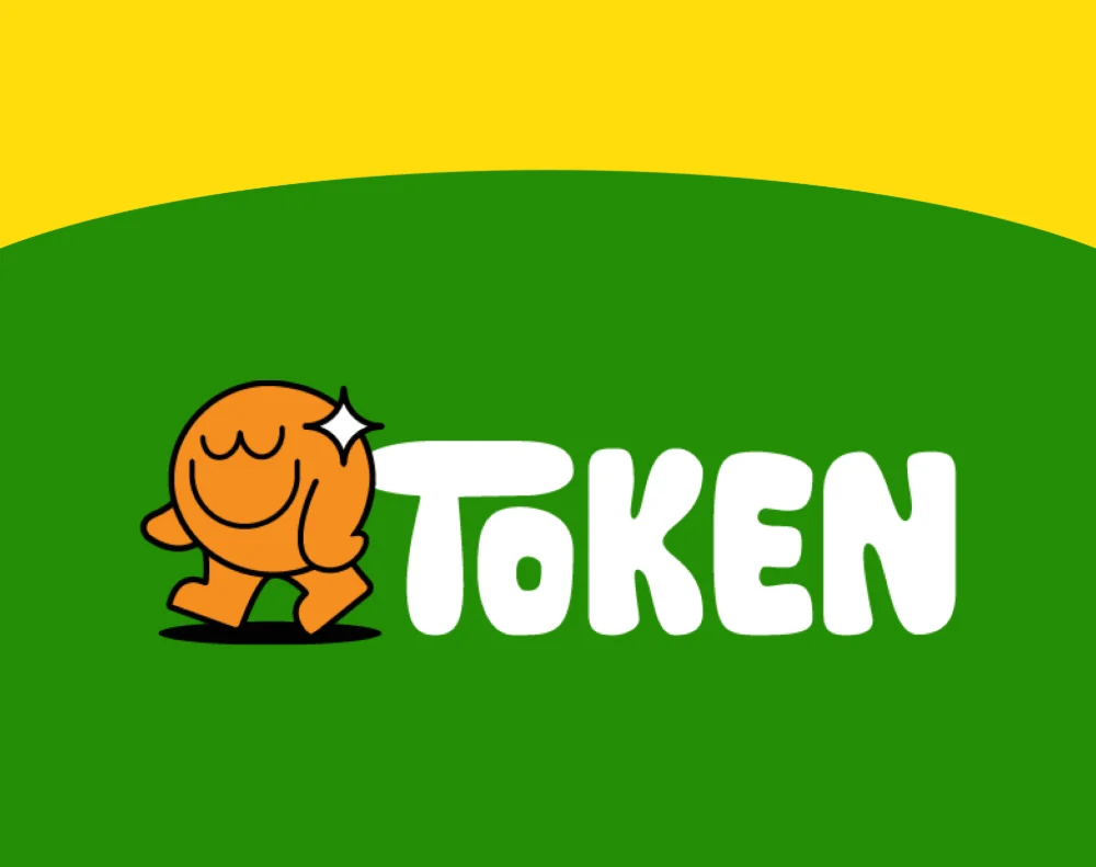 Token Toys wordmark and orange mascot